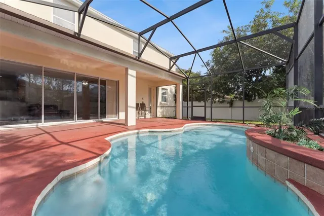 a view of a backyard with basket ball court