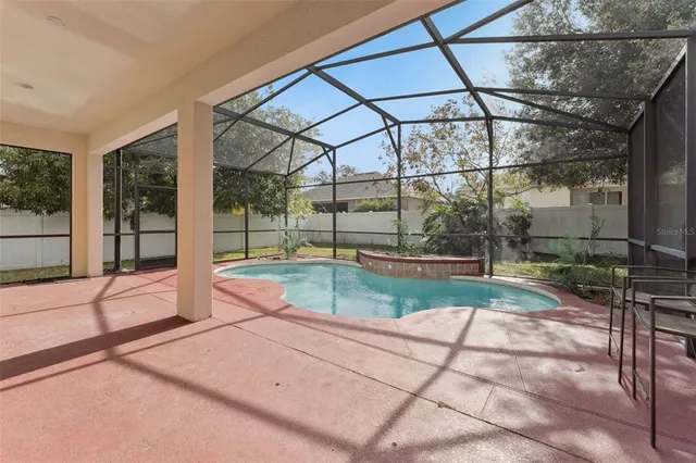 a view of yard with wooden fence