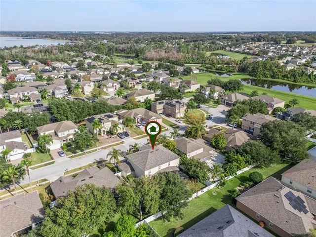an aerial view of residential houses with outdoor space