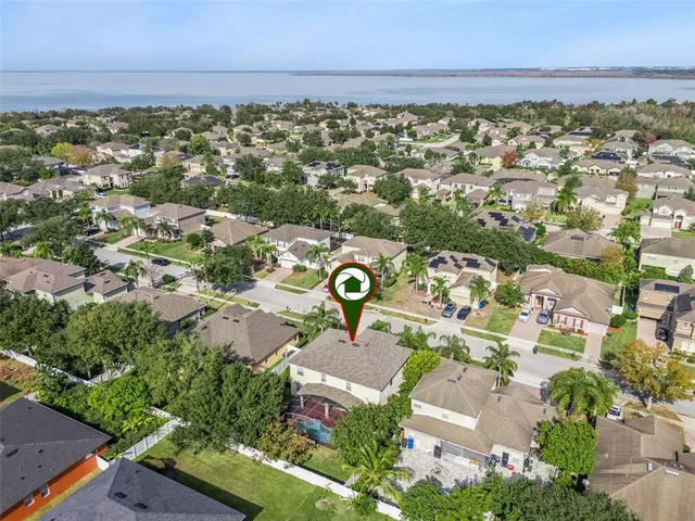 an aerial view of house with yard