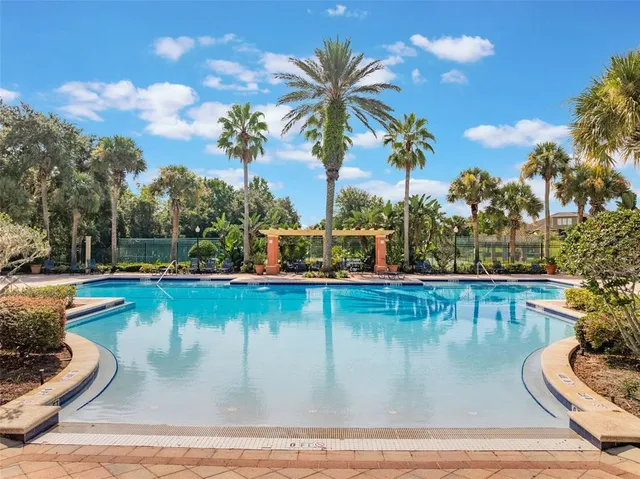a view of a swimming pool with a lounge chairs