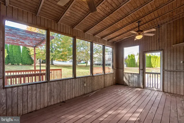 a view of porch with wooden floor and outdoor seating