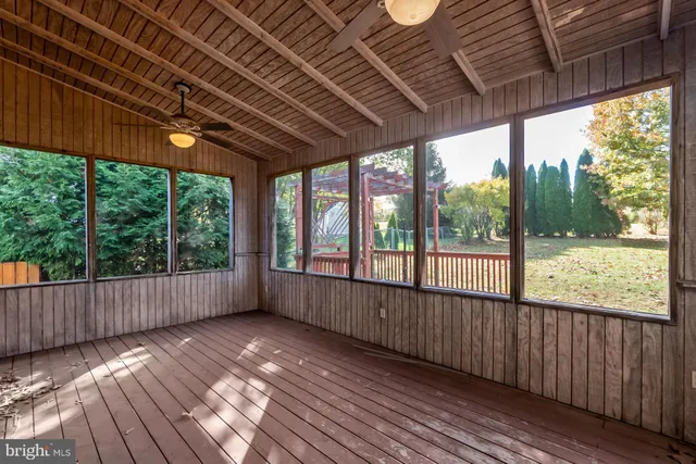 a view of a room with wooden floor and roof
