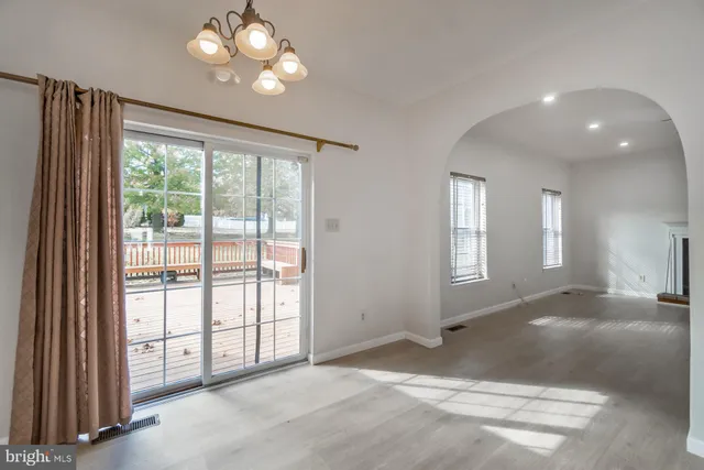 a kitchen with stainless steel appliances granite countertop a refrigerator stove and sink