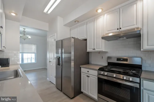 a kitchen with a sink and cabinets