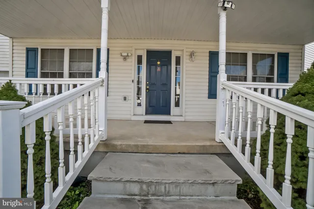 a view of a house with entrance gate