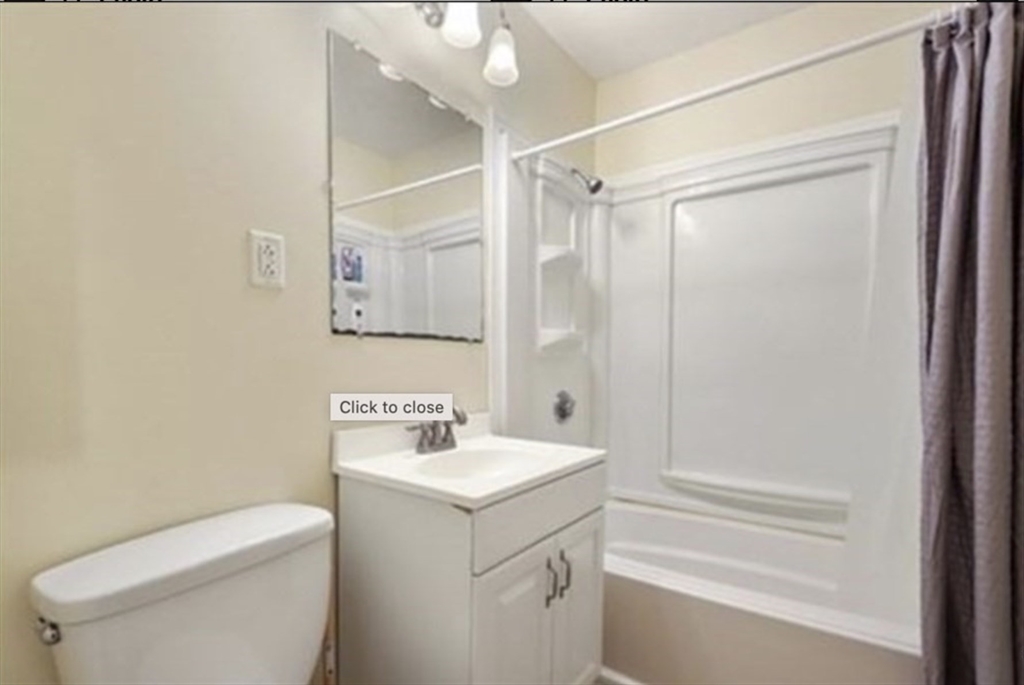 116 Spring Street, Unit A4 Boston, MA 02132 - Photo 5 of 7 a bathroom with a sink a toilet and shower