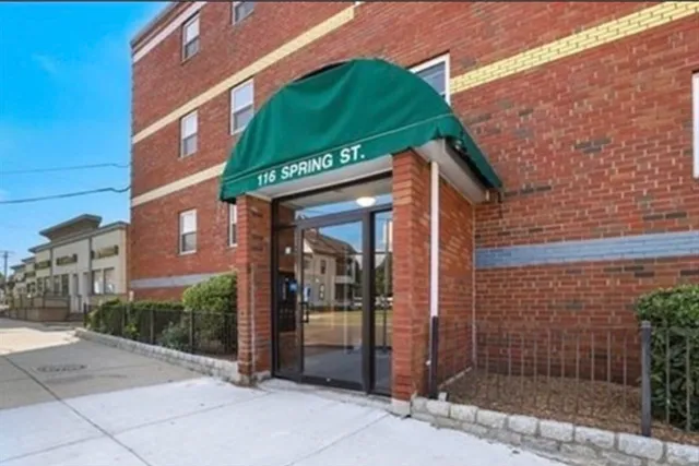 a view of a brick building with a large windows