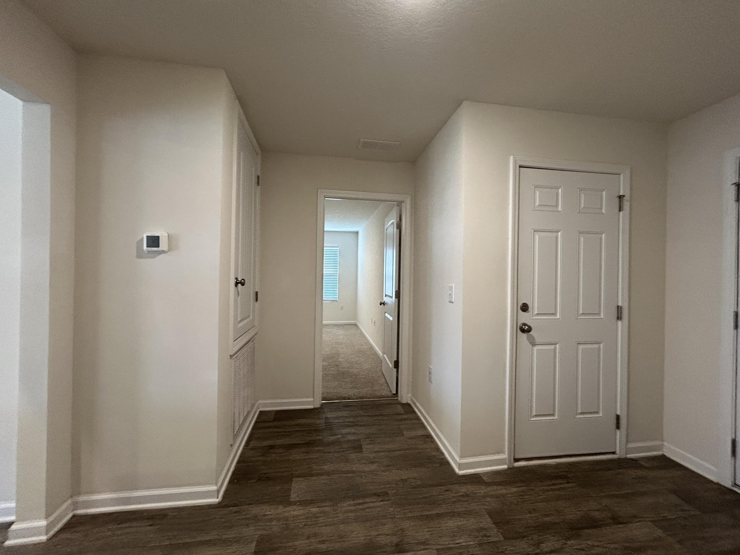 916 Merganser Way Crestview, FL 32539 - Photo 2 of 37 a view of a hallway with wooden floor