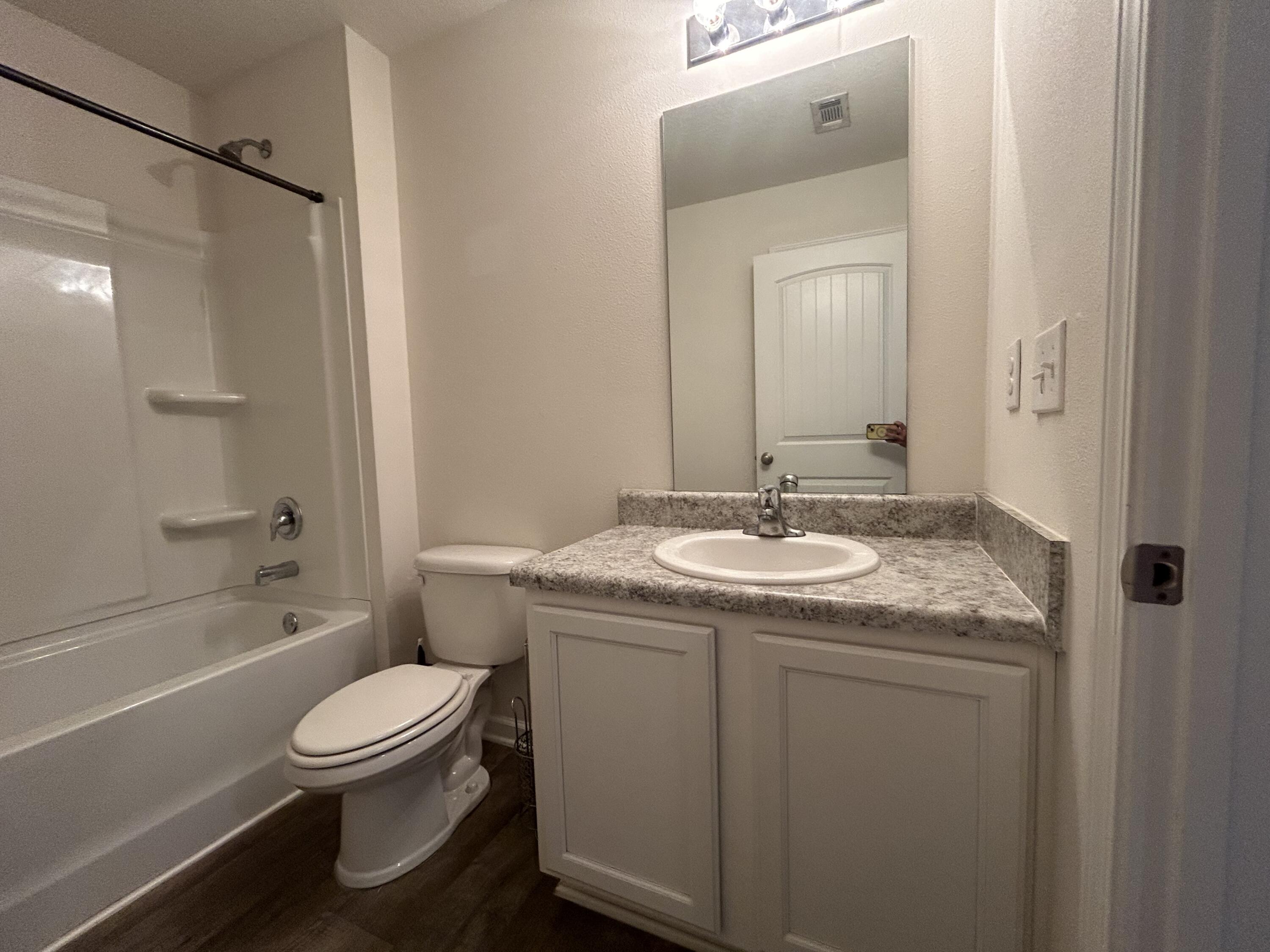 916 Merganser Way Crestview, FL 32539 - Photo 23 of 37 a bathroom with a granite countertop sink toilet and shower