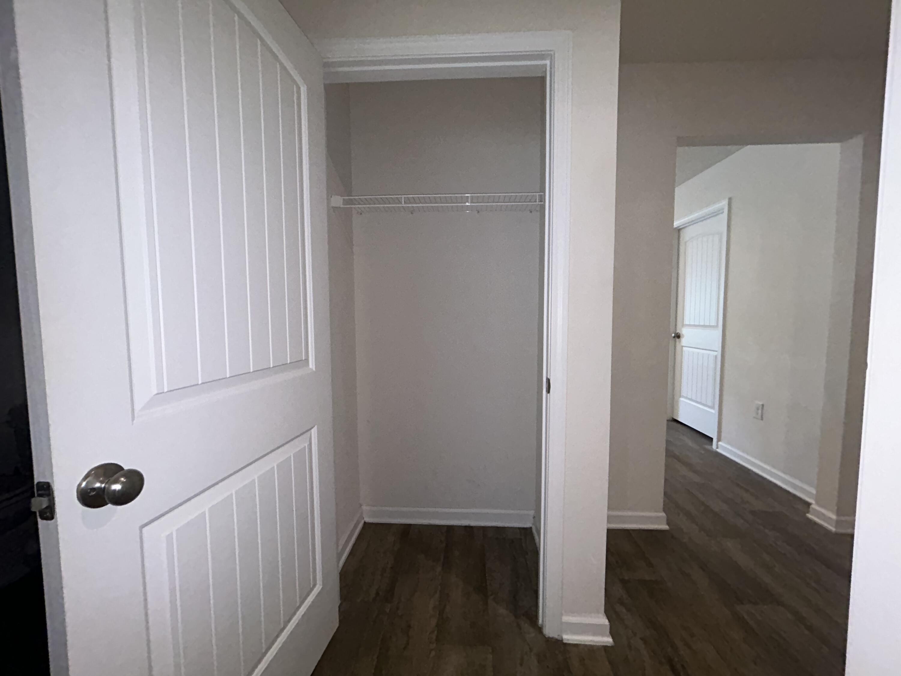 916 Merganser Way Crestview, FL 32539 - Photo 25 of 37 a view of a hallway with wooden floor