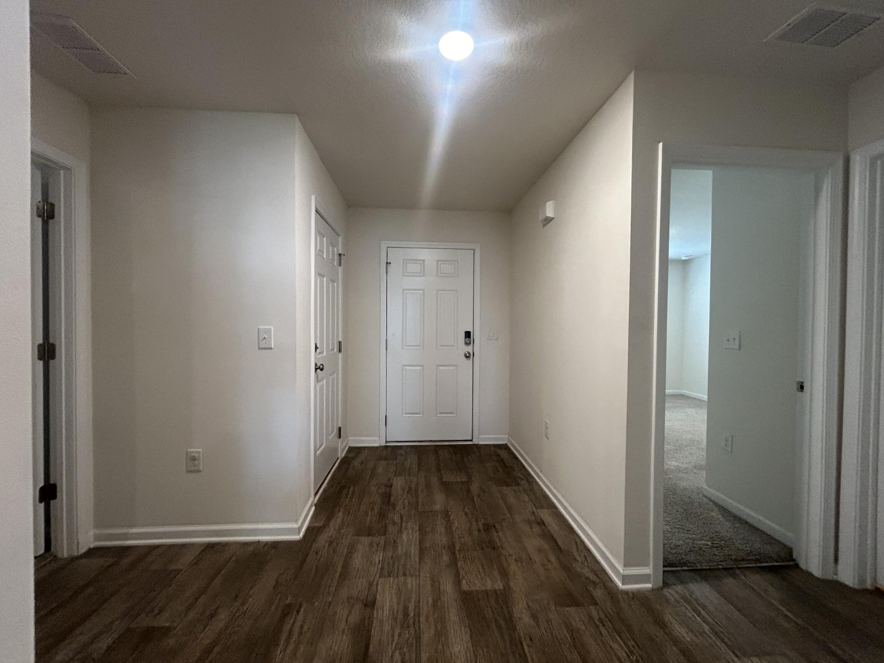 916 Merganser Way Crestview, FL 32539 - Photo 29 of 37 a view of a hallway with wooden floor and closet