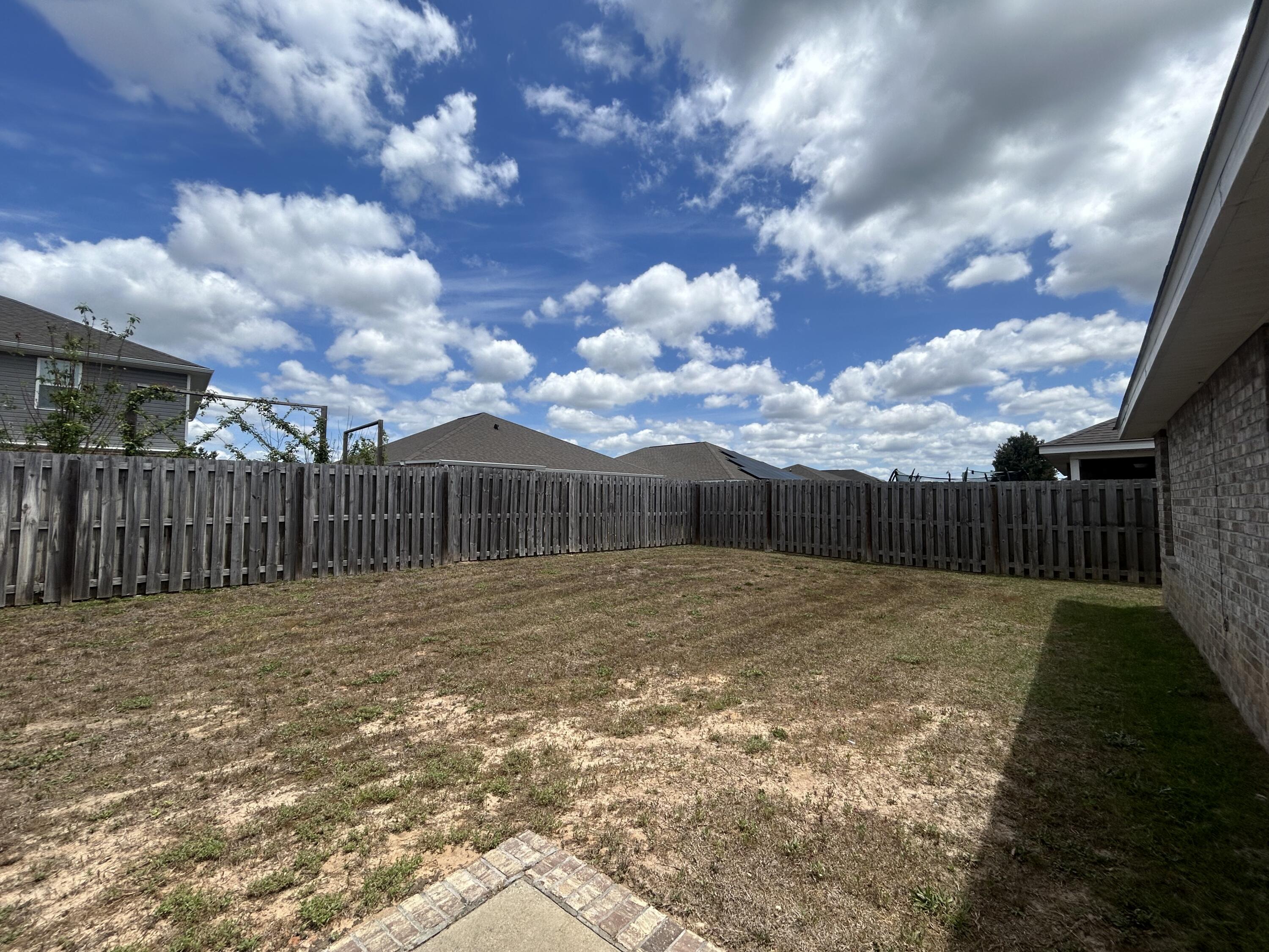 916 Merganser Way Crestview, FL 32539 - Photo 36 of 37 a view of backyard with wooden fence