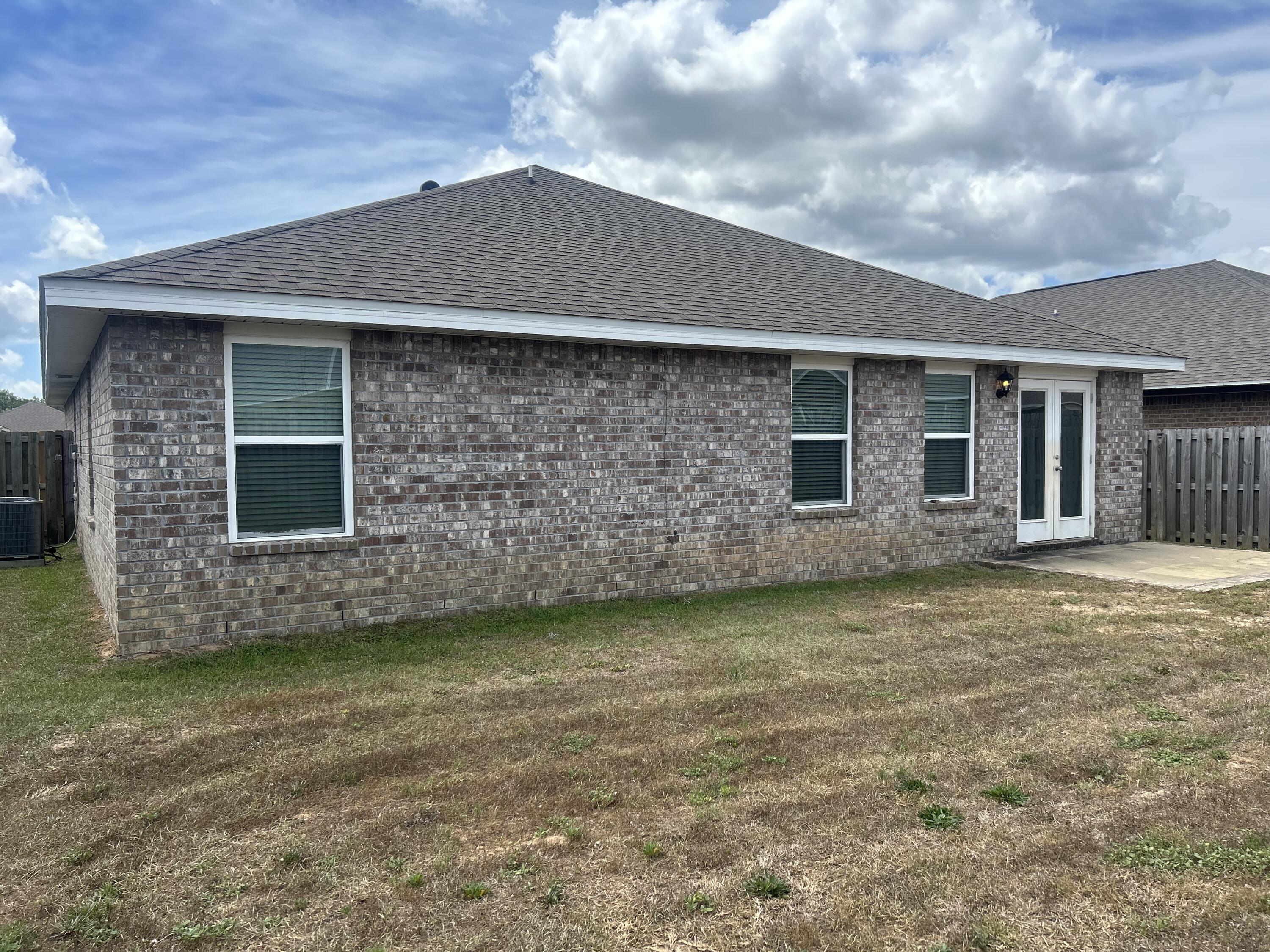 916 Merganser Way Crestview, FL 32539 - Photo 37 of 37 a front view of a house with a garden