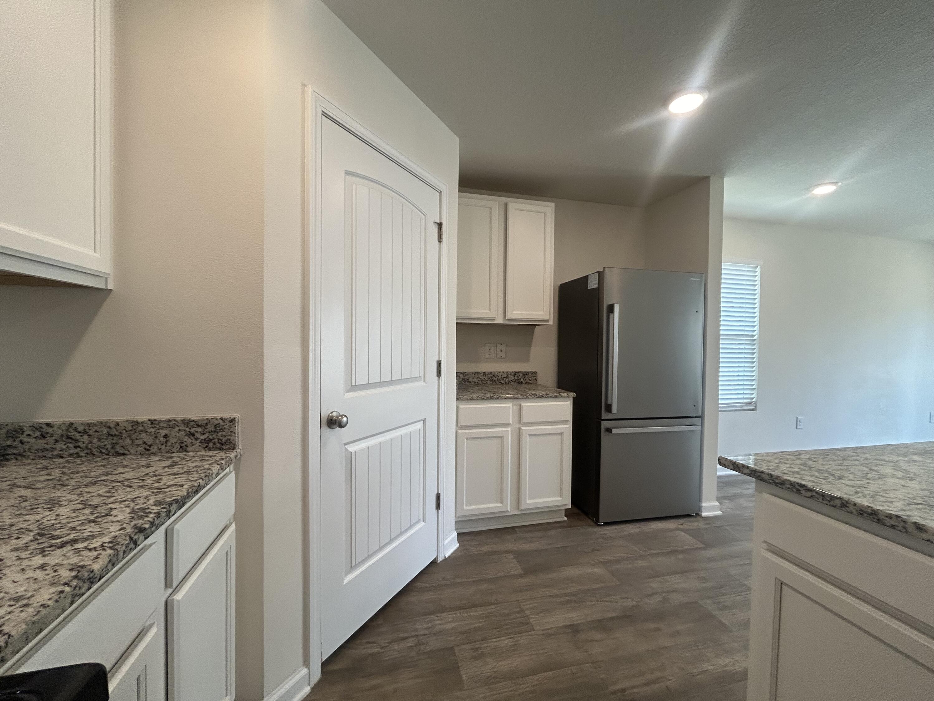 916 Merganser Way Crestview, FL 32539 - Photo 8 of 37 a kitchen with a refrigerator sink and stove