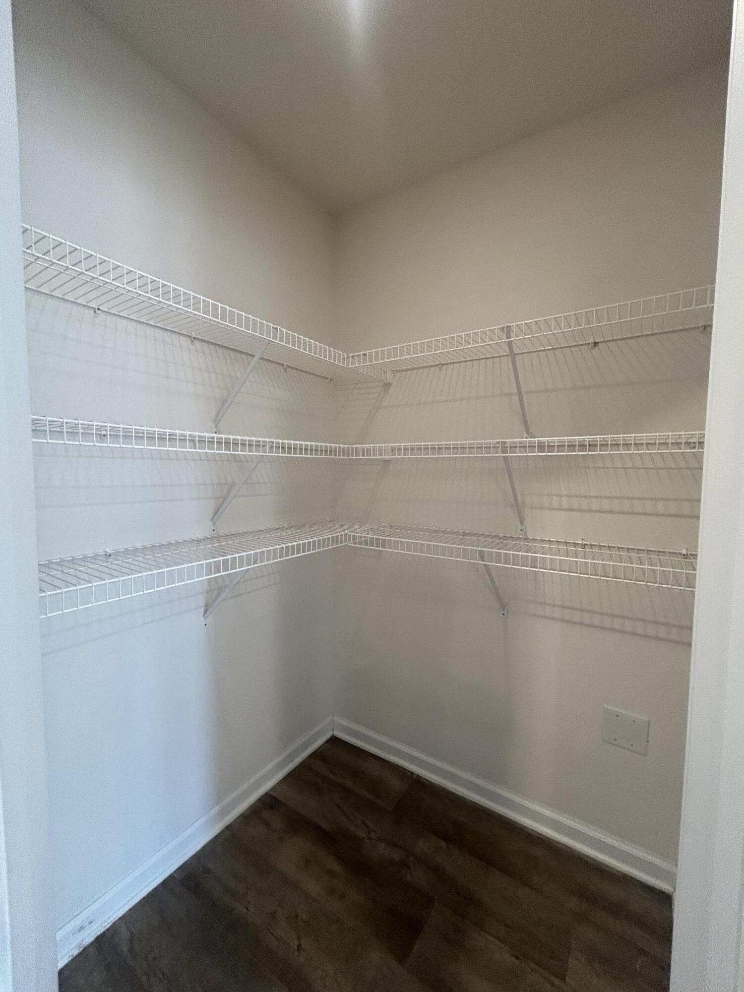 916 Merganser Way Crestview, FL 32539 - Photo 10 of 37 a view of a room with empty racks