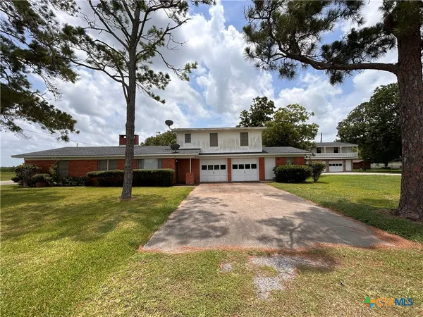 a view of a swimming pool with a yard