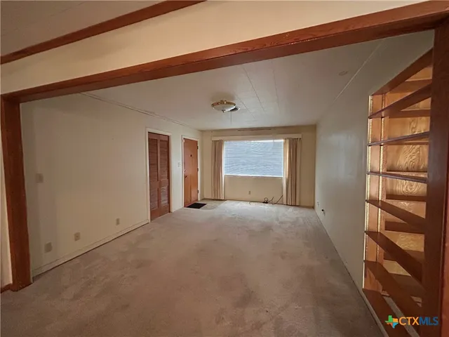 a view of empty room with a window