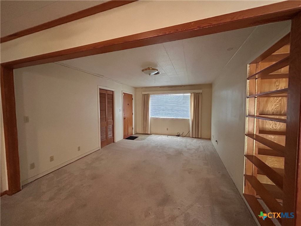 614 Apollo Drive Edna, TX 77957 - Photo 12 of 41 a view of empty room with a window