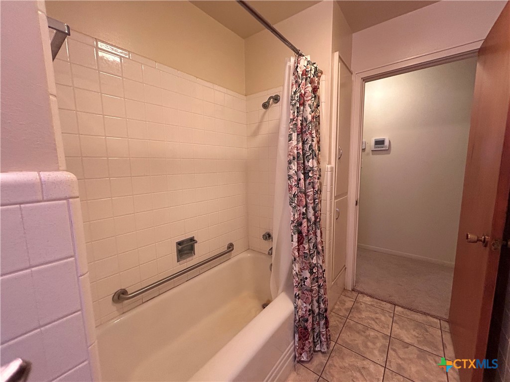 614 Apollo Drive Edna, TX 77957 - Photo 18 of 41 a bathroom with a bathtub and shower