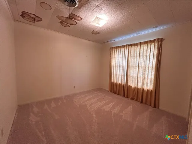 a view of a livingroom with furniture and window