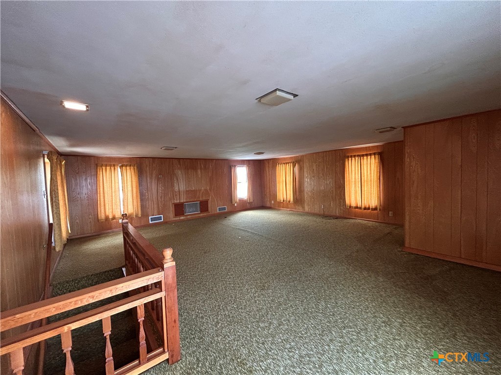 614 Apollo Drive Edna, TX 77957 - Photo 22 of 41 a view of an empty room with window and chandelier