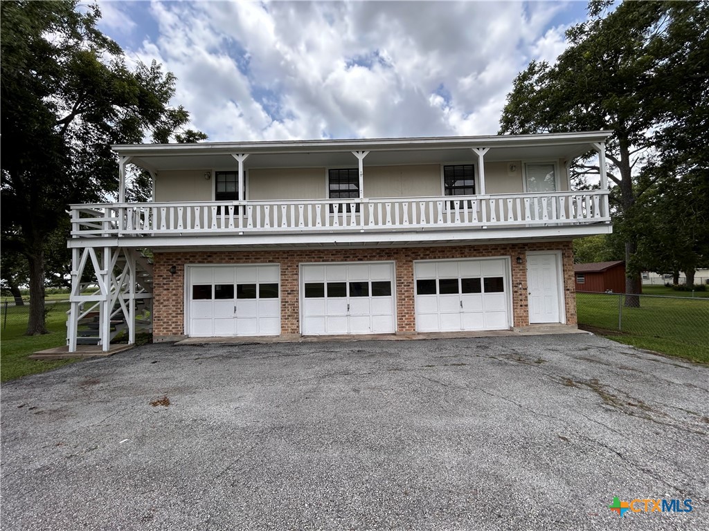 614 Apollo Drive Edna, TX 77957 - Photo 28 of 41 a front view of a house with plants