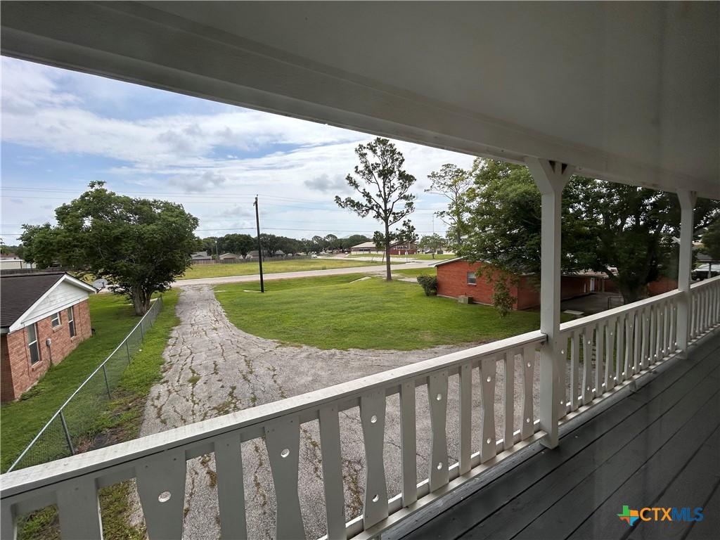614 Apollo Drive Edna, TX 77957 - Photo 37 of 41 a view of a porch with wooden floor and fence
