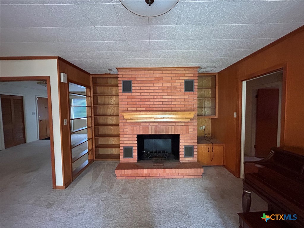 614 Apollo Drive Edna, TX 77957 - Photo 10 of 41 a view of an empty room with window and fire place
