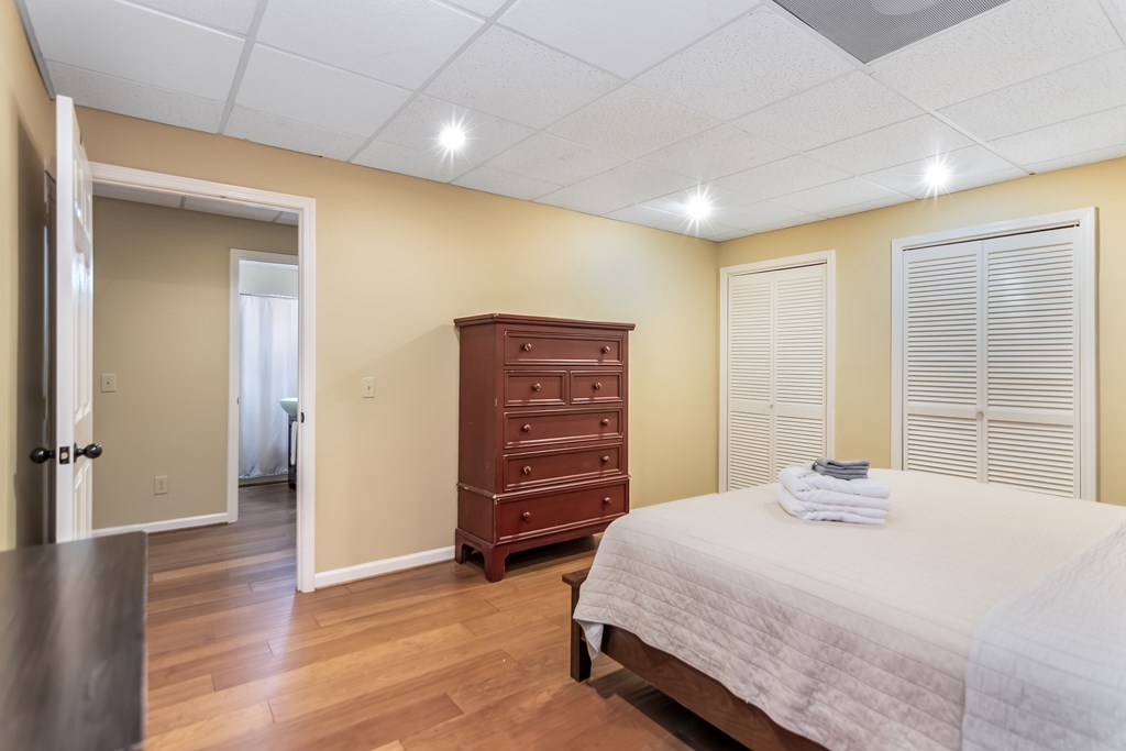 22 Waterloon Trail Morganton, GA 30560 - Photo 66 of 71 a bedroom with a bed and wooden floor