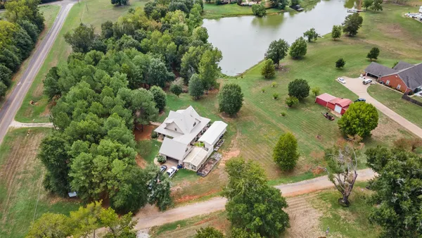 an aerial view of a house with a lake view