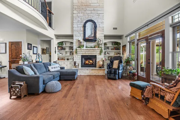 a living room with furniture fireplace and flat screen tv
