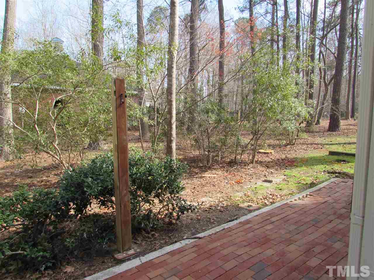 644 Weathergreen Drive Raleigh, NC 27615 - Photo 12 of 24 a view of a yard with plants and trees
