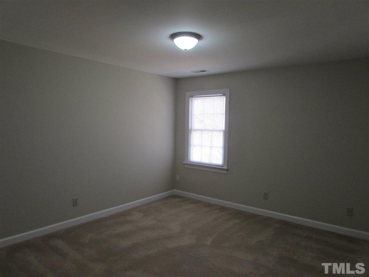 644 Weathergreen Drive Raleigh, NC 27615 - Photo 18 of 24 an empty room with a window