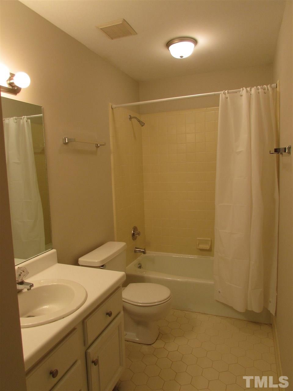 644 Weathergreen Drive Raleigh, NC 27615 - Photo 19 of 24 a bathroom with a granite countertop sink toilet and shower