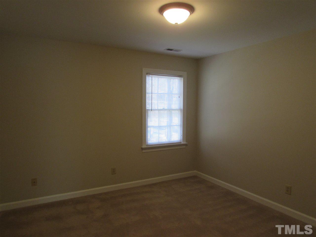 644 Weathergreen Drive Raleigh, NC 27615 - Photo 20 of 24 an empty room with a window