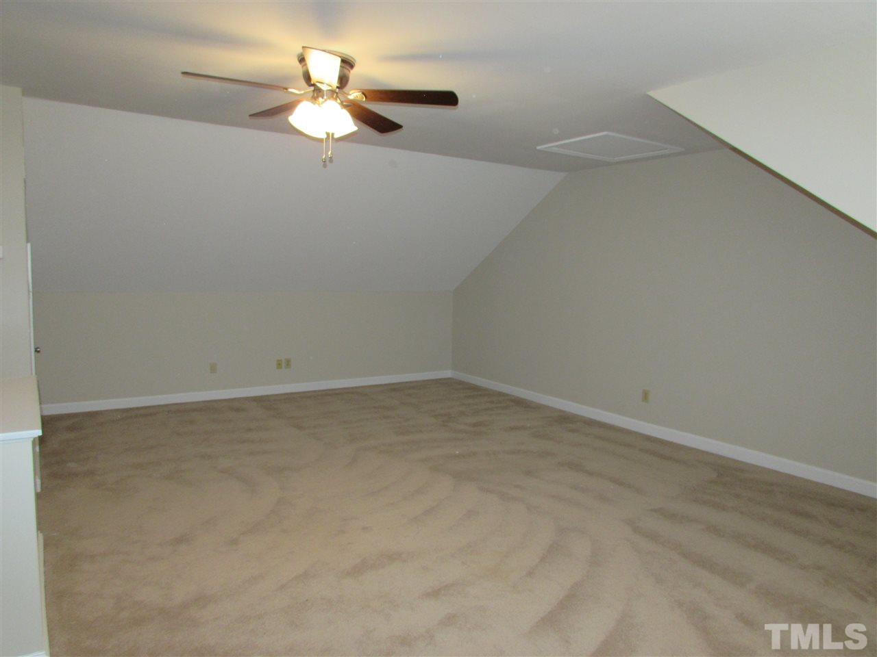 644 Weathergreen Drive Raleigh, NC 27615 - Photo 21 of 24 a view of a room with a ceiling fan and window