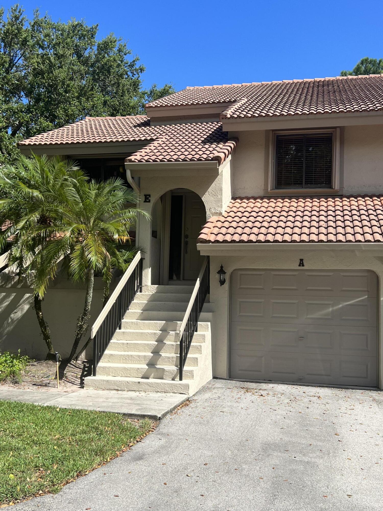 5740 Coach House Circle, Unit E Boca Raton, FL 33486 - Photo 1 of 26 Tammy front of house 2