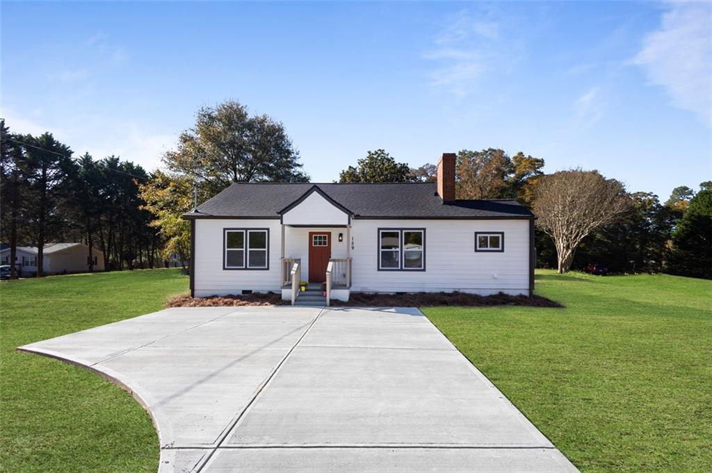 a front view of a house with yard