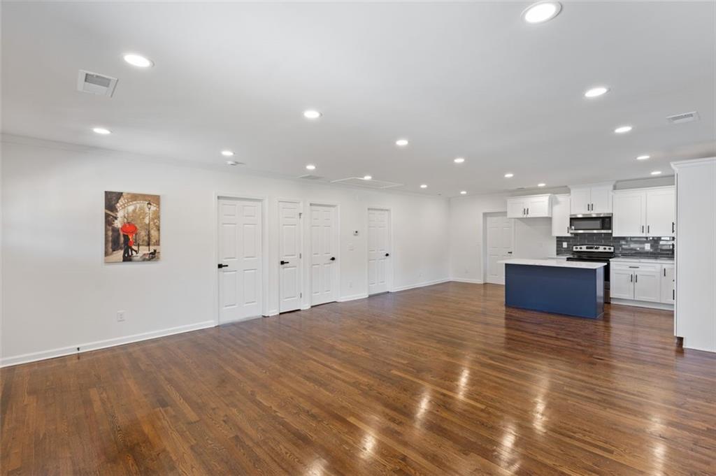 159 Pine Valley Road Bogart, GA 30622 - Photo 14 of 40 a large kitchen with kitchen island a sink stainless steel appliances and cabinets