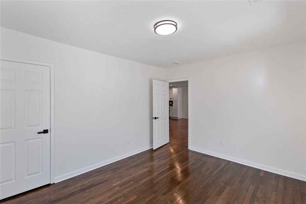 159 Pine Valley Road Bogart, GA 30622 - Photo 19 of 40 a view of an empty room with wooden floor