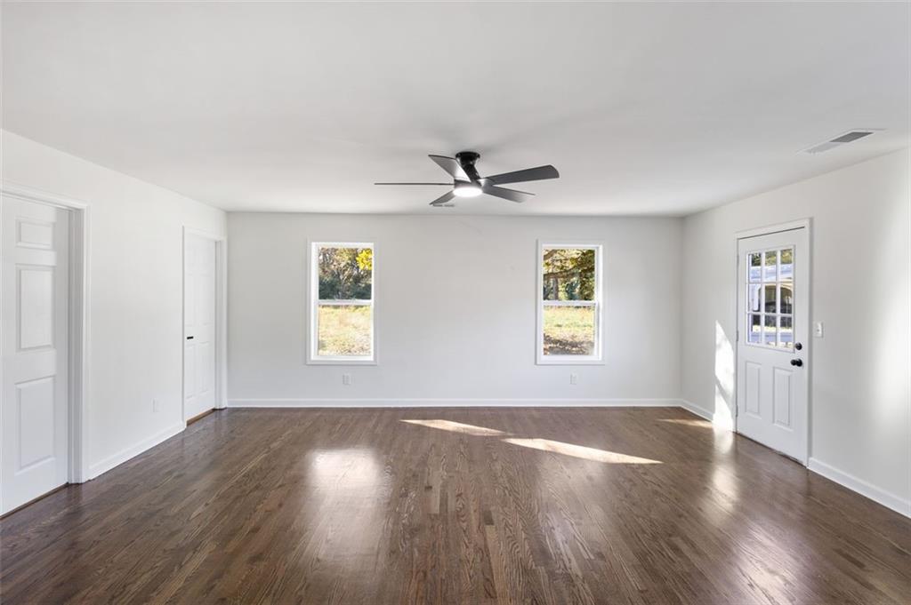 159 Pine Valley Road Bogart, GA 30622 - Photo 25 of 40 wooden floor in an empty room with a window