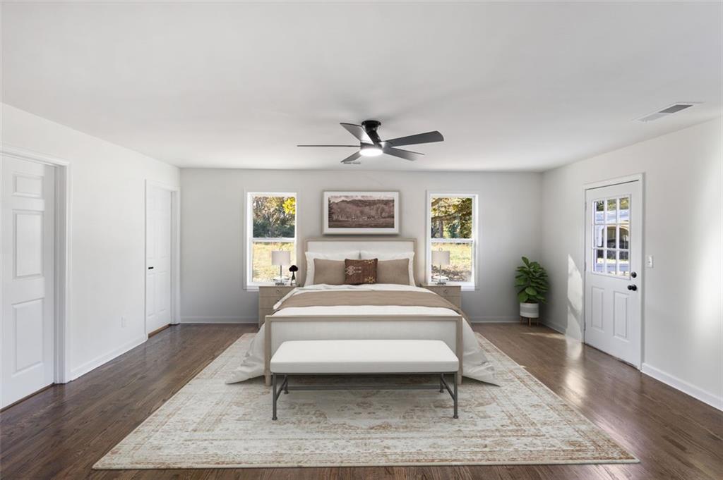 159 Pine Valley Road Bogart, GA 30622 - Photo 26 of 40 a spacious bedroom with a bed and a table