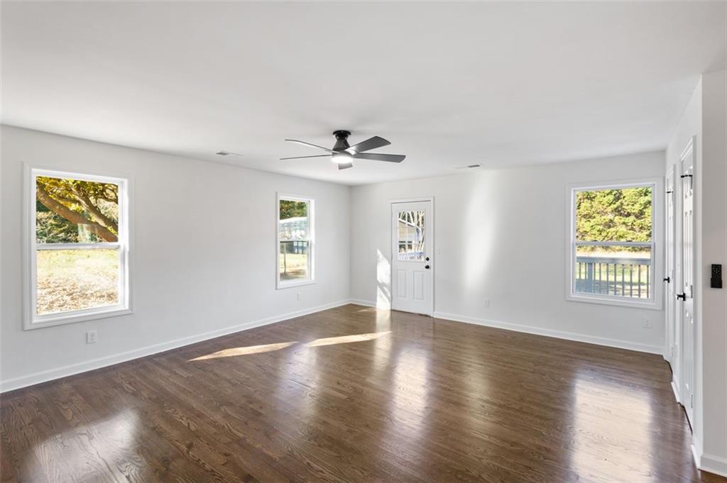 159 Pine Valley Road Bogart, GA 30622 - Photo 29 of 40 a view of an empty room with a window and wooden floor