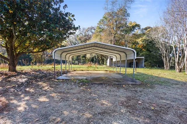 a view of house with a yard