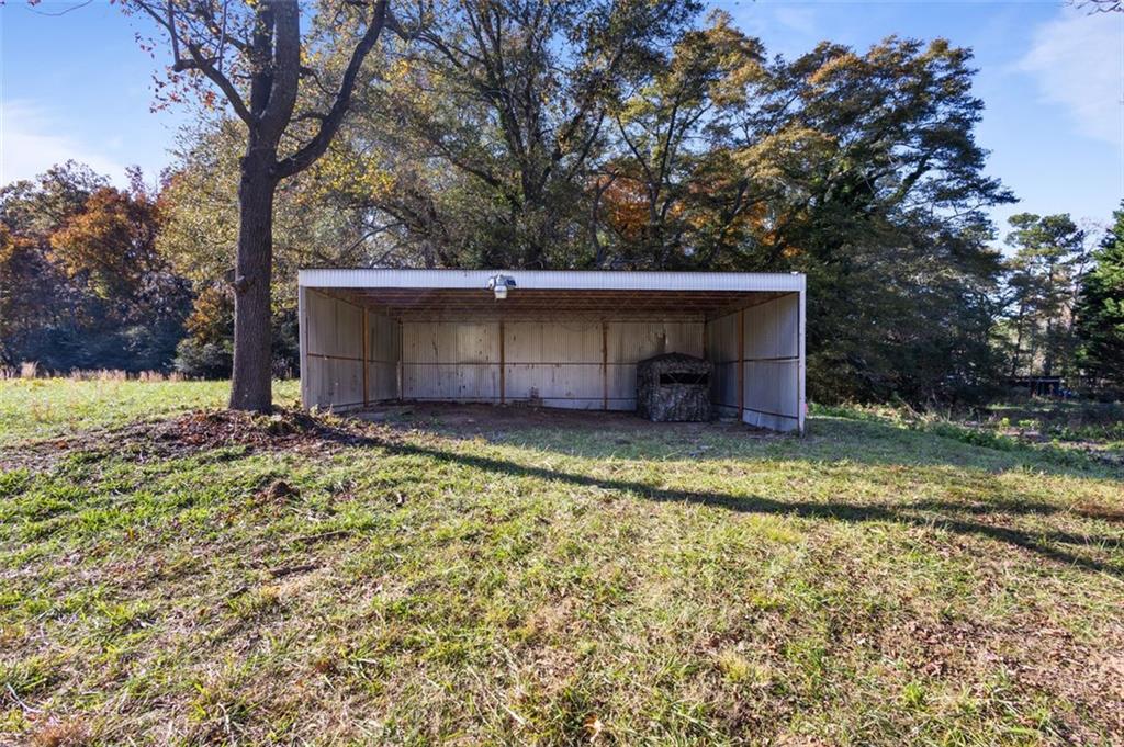 159 Pine Valley Road Bogart, GA 30622 - Photo 33 of 40 a view of a backyard with a large tree