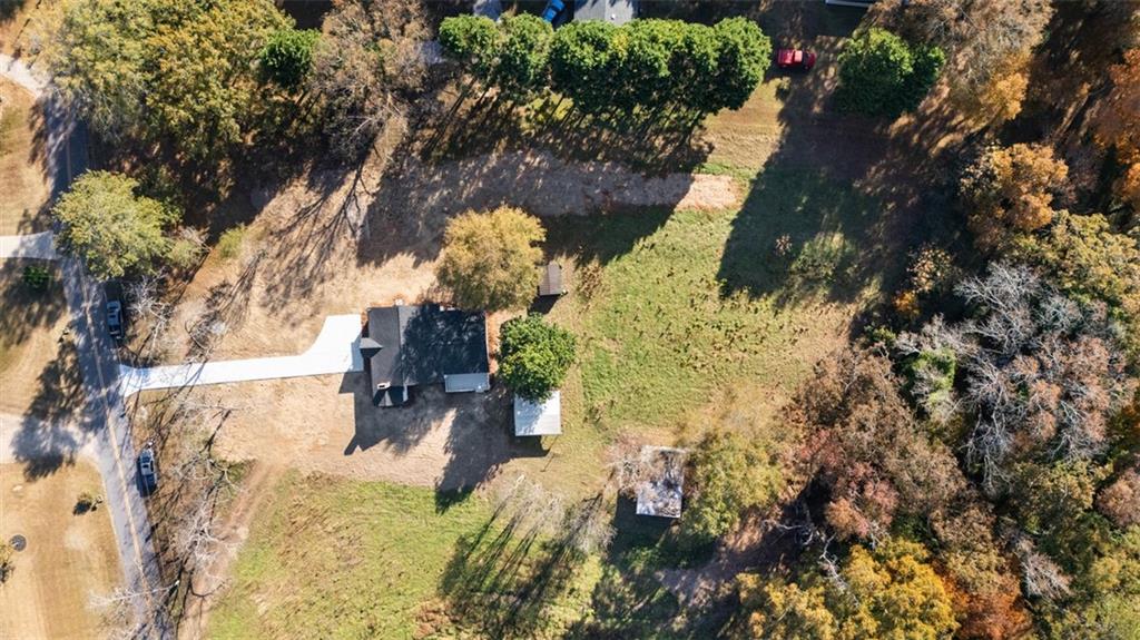 159 Pine Valley Road Bogart, GA 30622 - Photo 35 of 38 a view of a yard with yellow house
