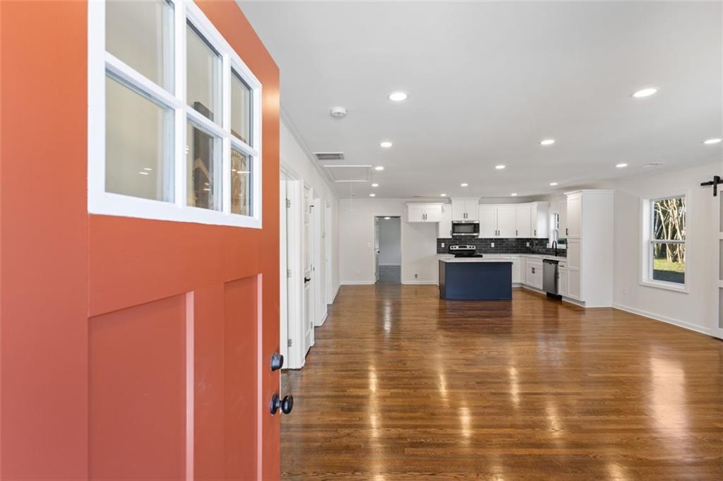 159 Pine Valley Road Bogart, GA 30622 - Photo 5 of 40 a view of kitchen dining table chairs microwave and stove