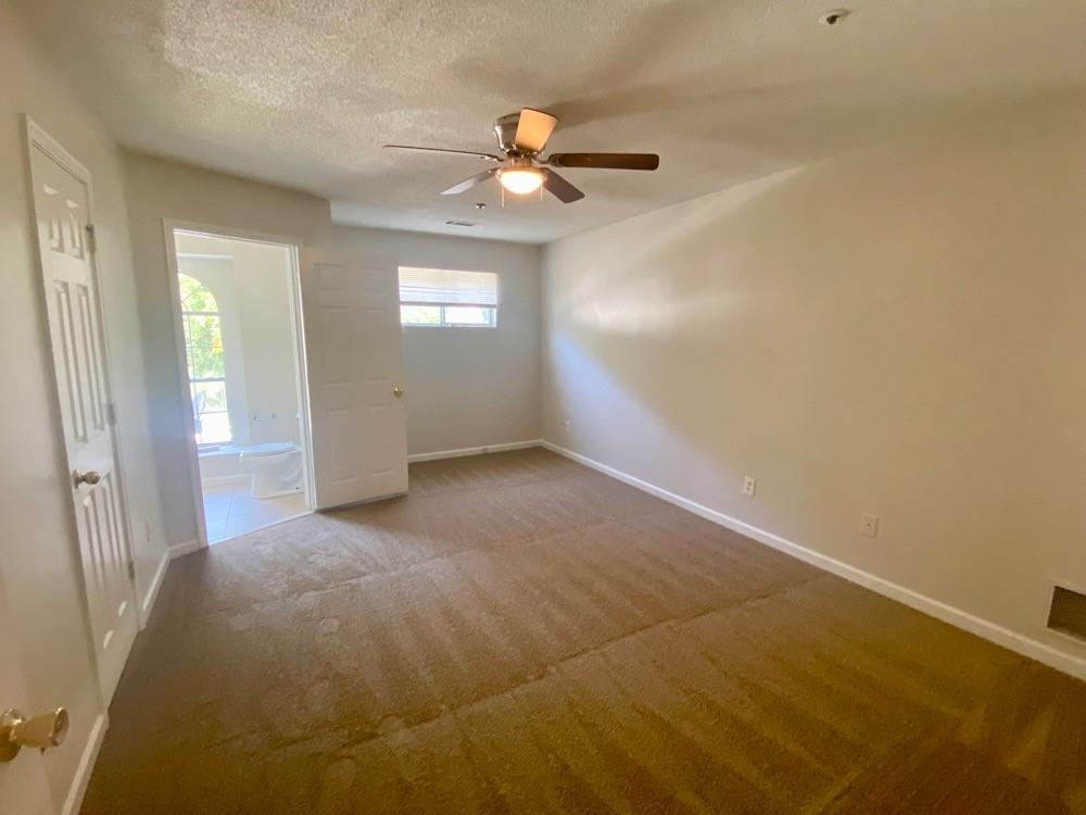 3746 Soapstone Road Decatur, GA 30034 - Photo 11 of 13 a view of a livingroom with a ceiling fan and window