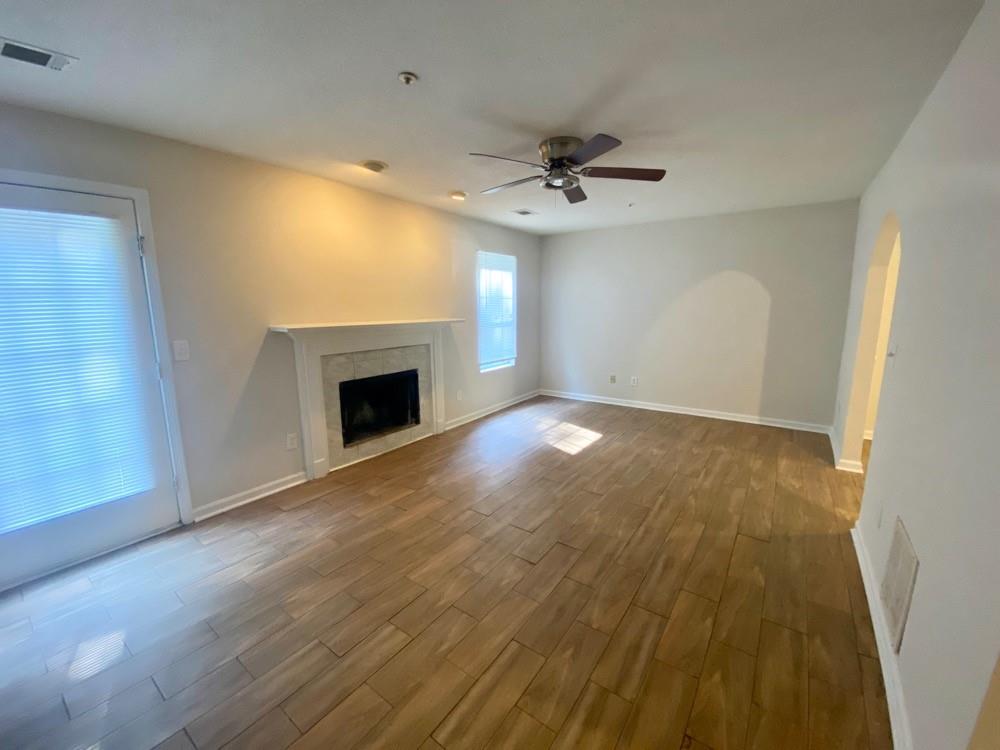 3746 Soapstone Road Decatur, GA 30034 - Photo 2 of 13 a view of an empty room with a fireplace and a window